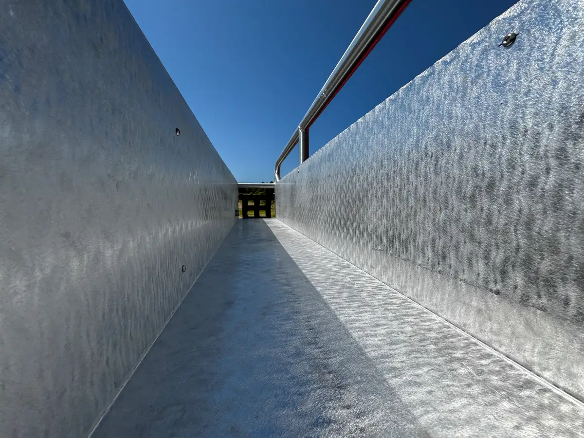 Rear wheel and suspension area close-up from underneath the body.